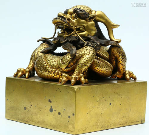 A GILT BRONZE CASTED SEAL