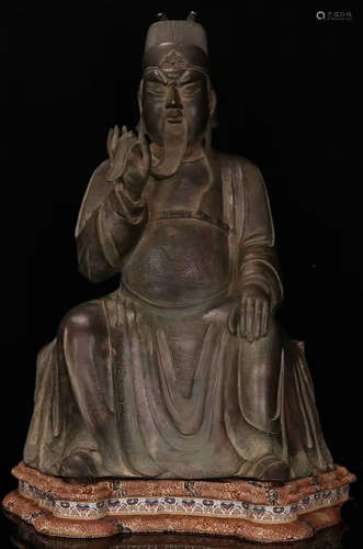 A COPPER CASTED GUANGONG SHAPED STATUE