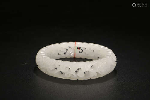 A CHINESE PIERCING HETIAN JADE BRACELET