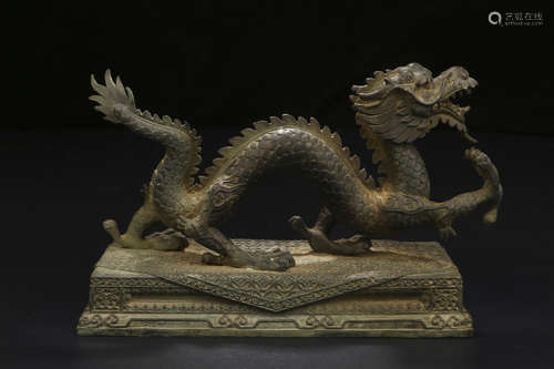 A CHINESE COPPER DRAGON ORNAMENT