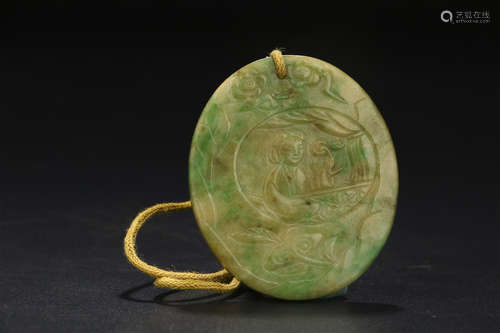 A CHINESE CARVED JADEITE PENDANT