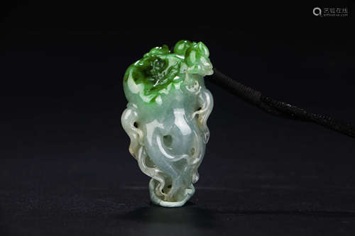 A CHINESE CARVED JADEITE PENDANT