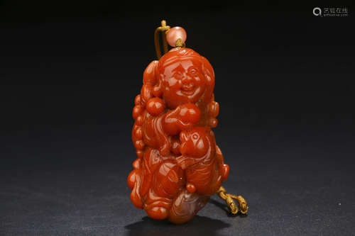 A CHINESE CARVED SOUTHERN RED AGATE ORNAMENT