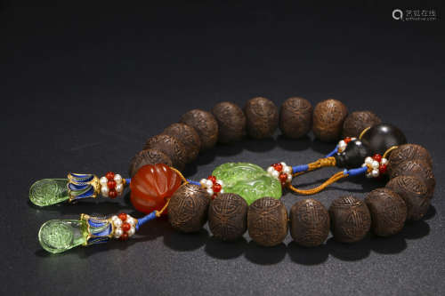 A CHINESE CARVED EAGLEWOOD BEADS HAND STRING