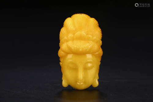 A CHINESE BEESWAX GUANYIN'S HEAD ORNAMENT