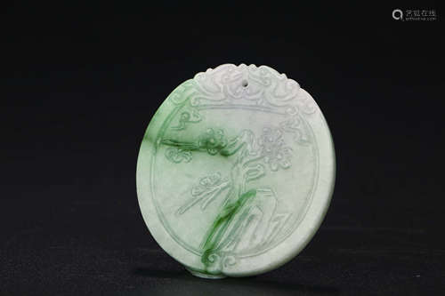 A CHINESE CARVED JADEITE PENDANT