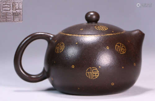 AN OUTLINE IN GOLD ZISHA POT WITH AUSPICIOUS PATTERN