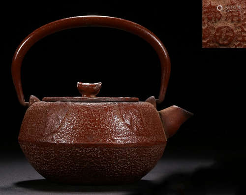 AN IRON POT CARVED WITH PATTERN