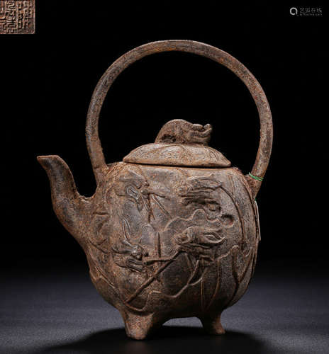 AN IRON POT CARVED WITH LOTUS PATTERN AND DRAGON