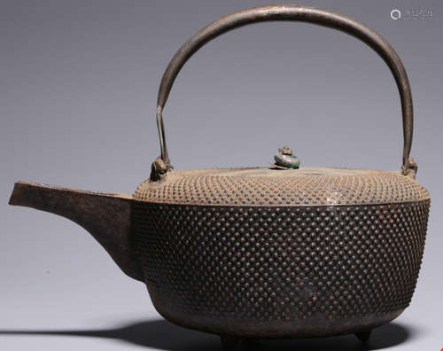 AN IRON POT CARVED WITH PATTERN