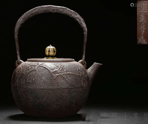 AN IRON POT CARVED WITH PLUM AND DRAGON