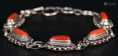 A SILVER CASTED BRACELET WITH CORAL