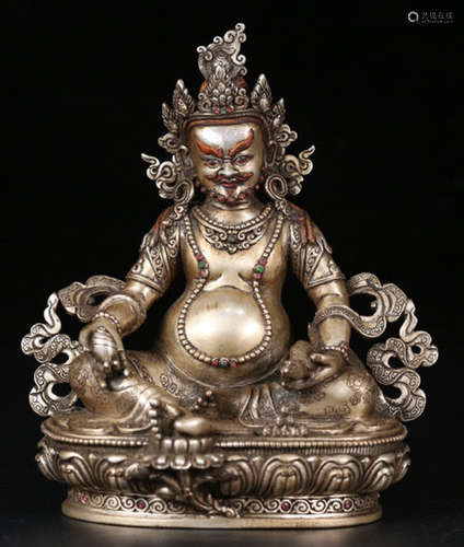 A SILVER CASTED YELLOW JAMBHALA BUDDHA STATUE