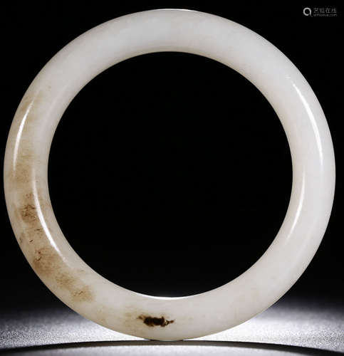 A HETIAN JADE CARVED AUSPICIOUS BANGLE