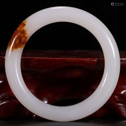 A HETIAN JADE CARVED BANGLE