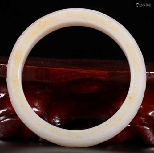 A HETIAN JADE CARVED BANGLE