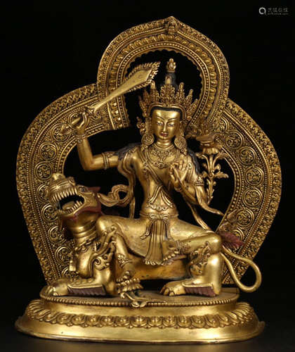 A GILT BRONZE CASTED MANJUSRI BUDDHA STATUE