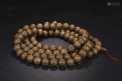 A CHINESE EAGLEWOOD BEADS HAND STRING