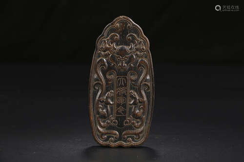 A CHINESE CARVED EAGLEWOOD TOKEN