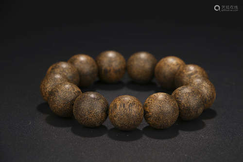 A CHINESE EAGLEWOOD BEADS HAND STRING