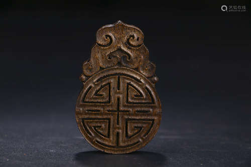 A CHINESE CARVED EAGLEWOOD PENDANT