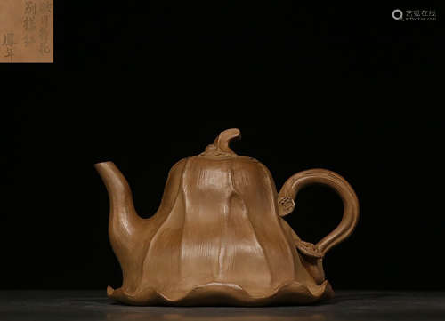 YIXING ZISHA CARVED 'LOTUS LEAVES' TEAPOT