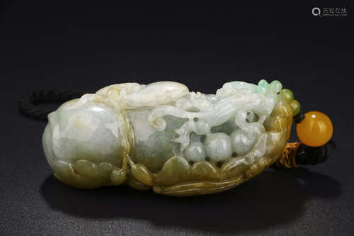 A CHINESE DRAGON CARVED JADEITE PENDANT