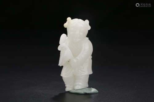 A CHINESE CARVED HETIAN JADE ORNAMENT