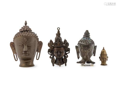 Four Southeast Asian Bronze Heads Height of largest 9