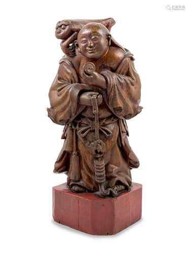 A Chinese Gilt Lacquered Wood Figure of Immortal Liu