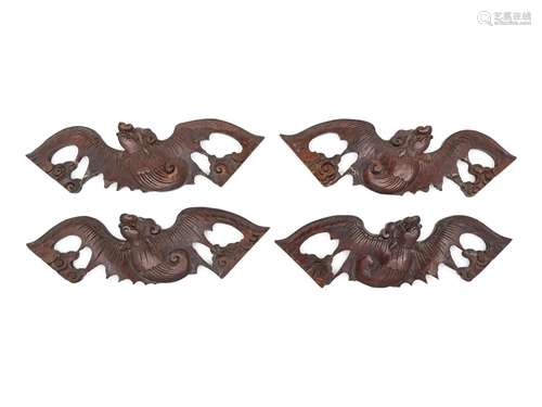 A Set of Four Chinese Hardwood Bat-Form Panels Each: