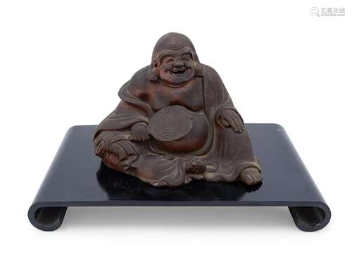 A Chinese Pottery Figure of a Laughing Buddha Height 7