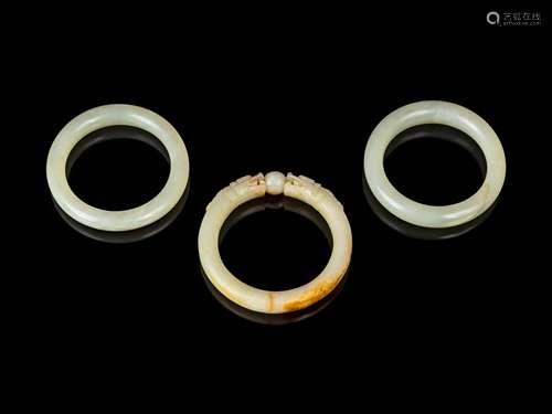 Three Chinese Jade and Hardstone Bangles Diam of