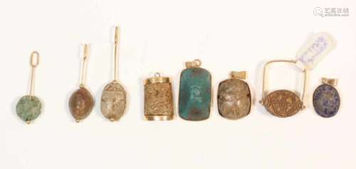 Egypt, collection of seven amulets and a ring, Late Period,unmarked 14K gold, with scarabs and