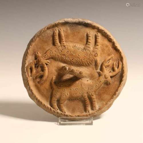 Central or Eastern Anatolia, circulair earthenware lid, 2nd Mill. BC,with in high relief