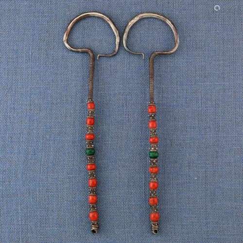 Mongolia, a pair of earringsdecorated with coral beads and one malachite bead. Ref. The Art of