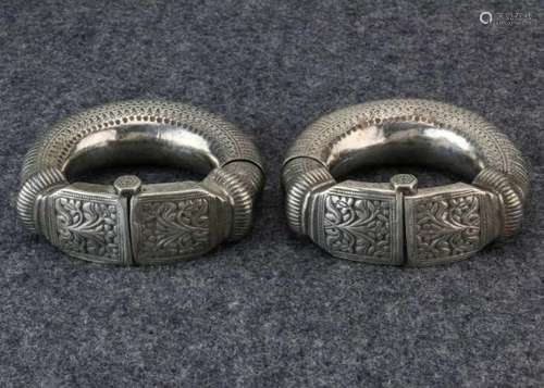 Oman, Nizwa, pair of silver ankletswith floral and leaf design. Can be opened by means of peg middle