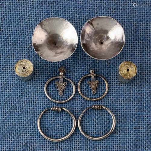 Golden Triangle, Myanmar, four pairs of silver earringsincluding a rolled, cylindrical pair and a