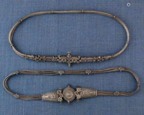 India, Maharashtra, Pune, two braided-wire belts,both with floral decoration, one with fishes in