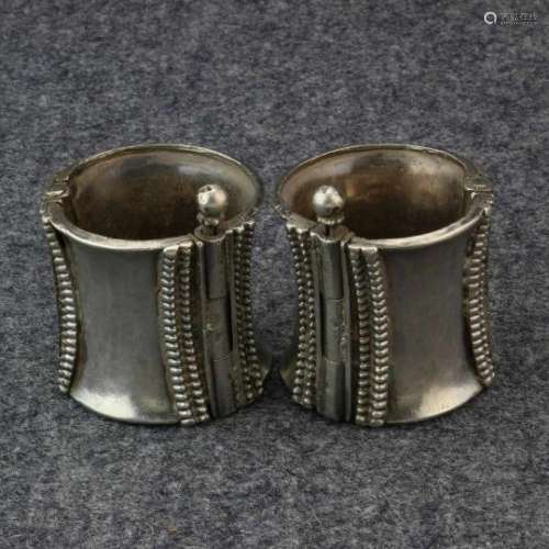 India, probably Radjasthan, pair of heavy solid silver bracelets,tubular shaped, with relief, h. 5.