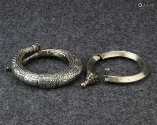 India, Rajasthan/Pakistan, two silver bracelets and a pair of silver ankletshollow bracelet with a