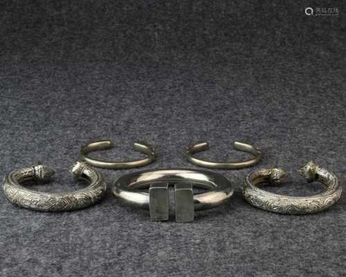 India, collection of a pair of alloyed silver children's anklets, pair of silver bracelets and a