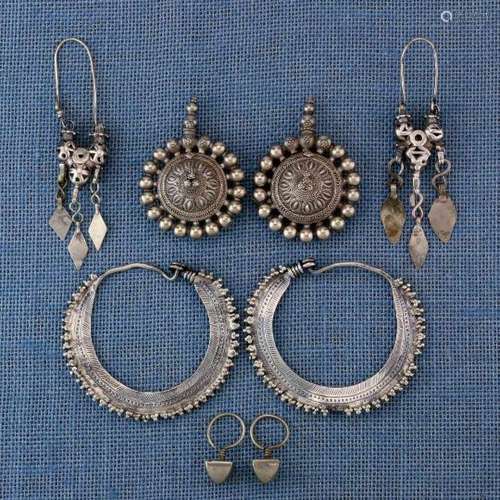 India, four pair of silver earrings a.o. Rajasthan earrings with knobs and twisted wire, worn by the