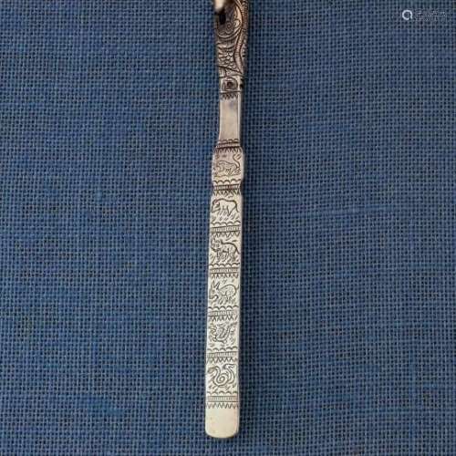 China, Hainan Island, silver hair pin with the head of a priest and engraved with 12 different