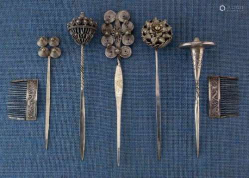 China, five hair pins and a pair of hair combs a.o. Miao, decorated with spirals, flowers and knobs,