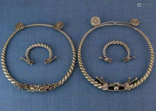 China, collection of twisted dragon head jewellery, two neck rings and a pair of bracelets;the