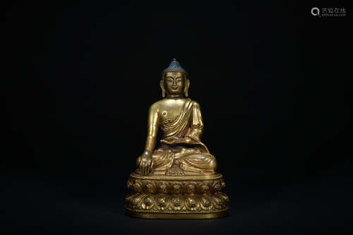 The 14th century gilt bronze statue of  shakyamuni