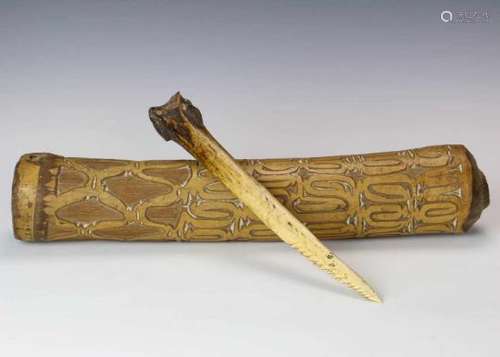 Papua, Asmat, carved bamboo horn and cassowary bone ceremonial dagger;the horn with deep carving.