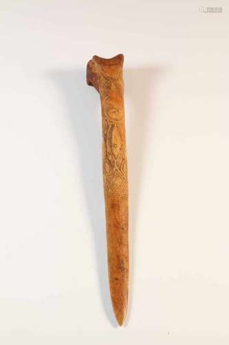 PNG, Abelam, ceremonial bone daggerwith carved ancestral figure, l. 35 cm. [1]300