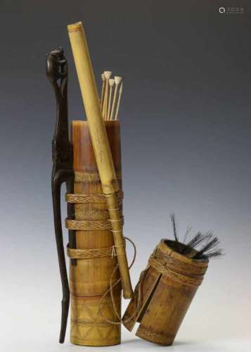 Indonesia Dayak, bambo arrow containerwith arrows and a carved wooden belt hook in the form of a